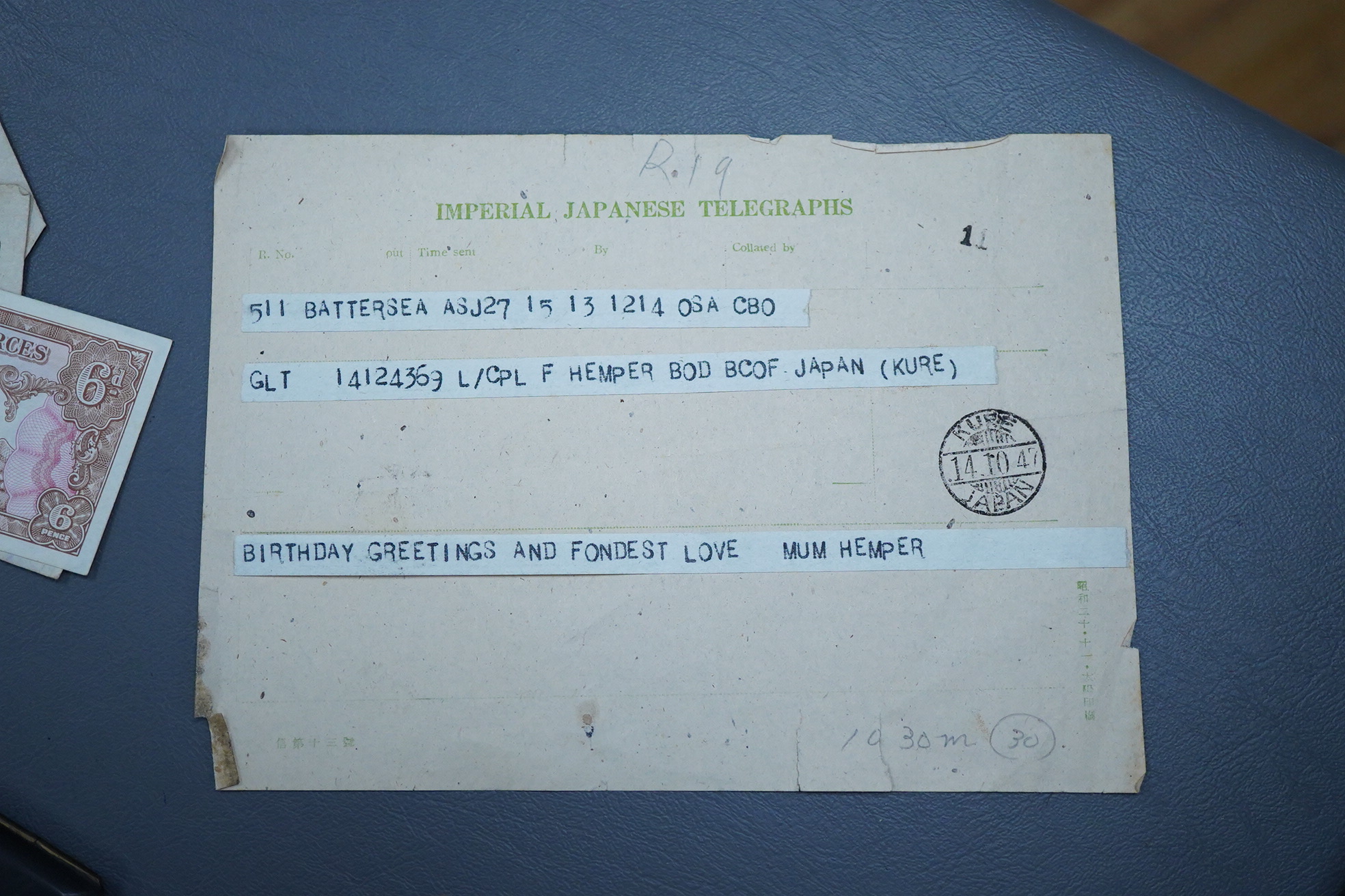 A Japanese photograph album, late 1940's to include banknotes and a telegram, together with a cigarette case